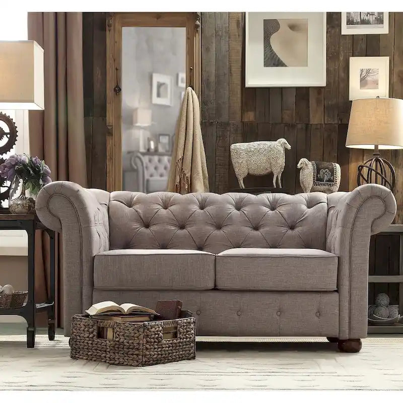 Causeuse Chesterfield à accoudoirs arrondis et capitonnée