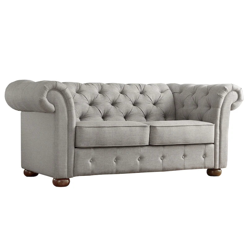 Causeuse Chesterfield à accoudoirs arrondis et capitonnée