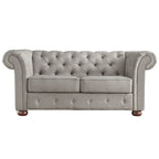 Causeuse Chesterfield à accoudoirs arrondis et capitonnée