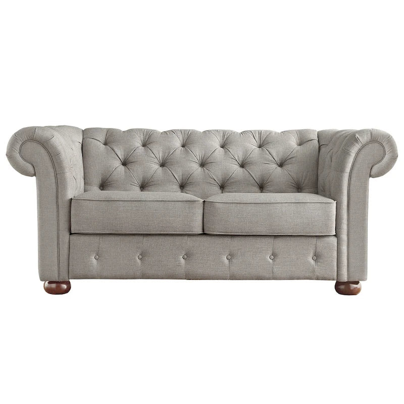 Causeuse Chesterfield à accoudoirs arrondis et capitonnée