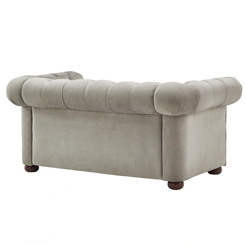 Causeuse Chesterfield à accoudoirs arrondis et capitonnée