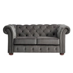 Causeuse Chesterfield à accoudoirs arrondis et capitonnée