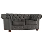 Causeuse Chesterfield à accoudoirs arrondis et capitonnée