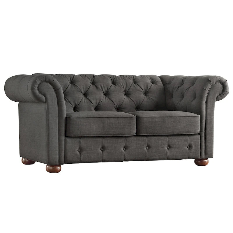 Causeuse Chesterfield à accoudoirs arrondis et capitonnée