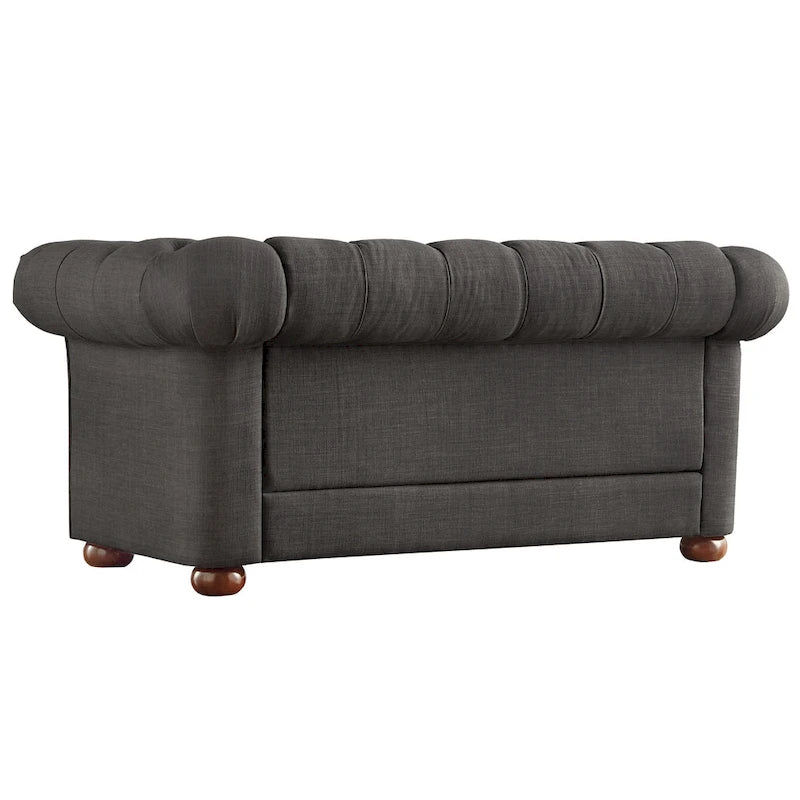 Causeuse Chesterfield à accoudoirs arrondis et capitonnée
