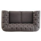Causeuse Chesterfield à accoudoirs arrondis et capitonnée